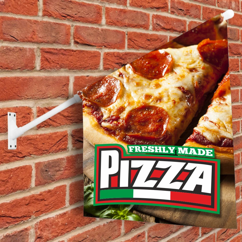 wall flag featuring a Slice of pizza with pepperoni on a wooden board against a brick wall, featuring a 'FRESHLY MADE PIZZA' sign.