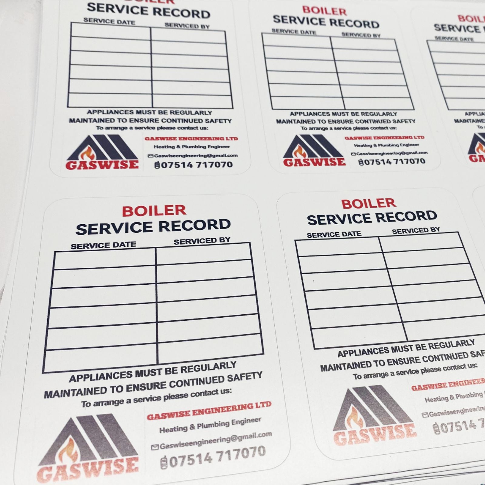 Boiler service record stickers sheet for plumbing and heating engineers showing maintenance history and service information