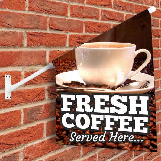 Decorative wall flag sign with a cup of coffee and 'Fresh Coffee Served Here' text on a brick wall background.