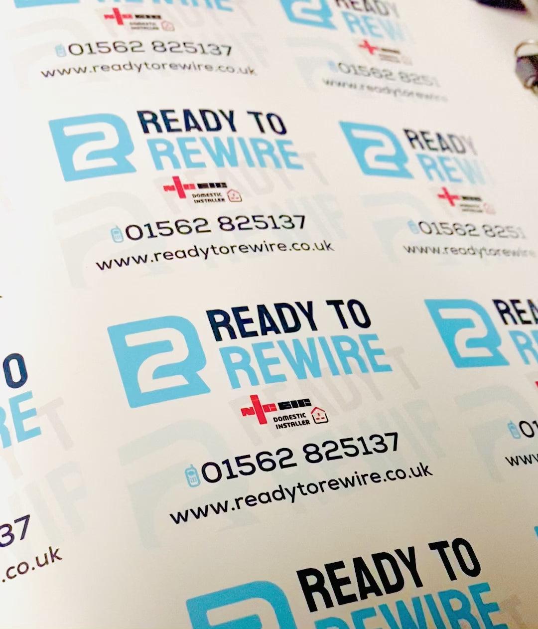 Custom business details vinyl labels showing personalised self-adhesive stickers with company logo and contact information